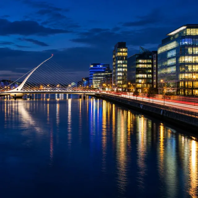 Dublin Docklands at night with the Samuel Beckett Bridge and light trails along the quays